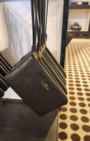 Coach Medium Corner Zip Wristlet in Signature Canvas