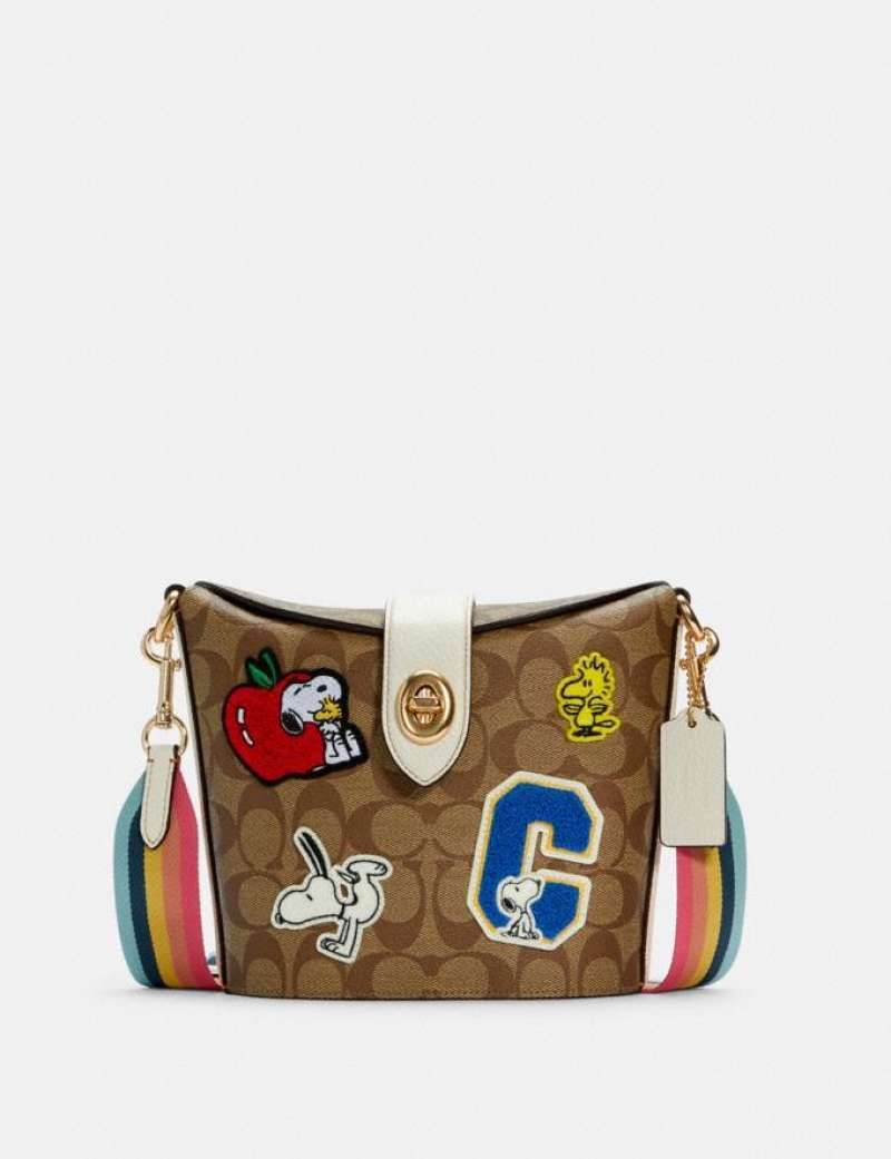 Coach snoopy peanuts addie croasbody