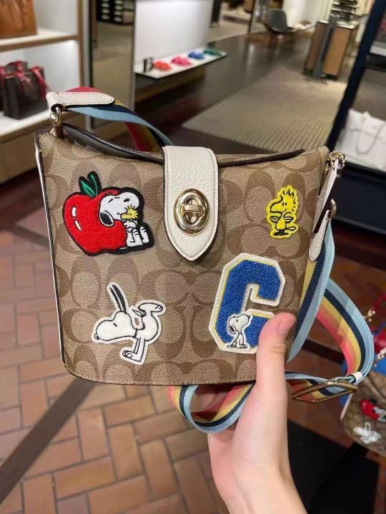 Coach snoopy peanuts addie croasbody